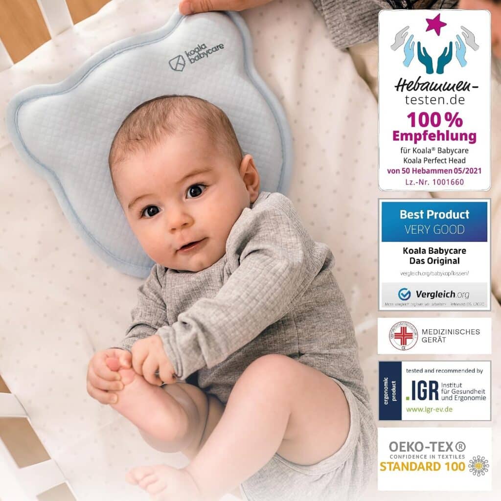 Matratzen kaufen Schweiz, Bettdecken kaufen Schweiz, Kopfkissen kaufen Schweiz Baby liegt mit dem Kopf in der Mulde des Koala Perfect Head Babykissens