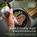 Mühle in der Hand beim Würzen, Mahlgrad stufenlos einstellbar